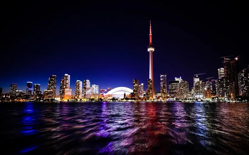Toronto City at night, showing the harbor, CN Tower, and the skykeepers around.